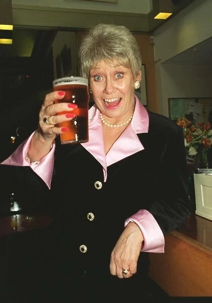 Liz Dawn Vera Duckworth of Coronation Street raises a glass to celebrate her taking over