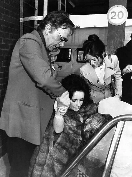 Liz Taylor and Richard Burton at Heathron Airport today December 1973