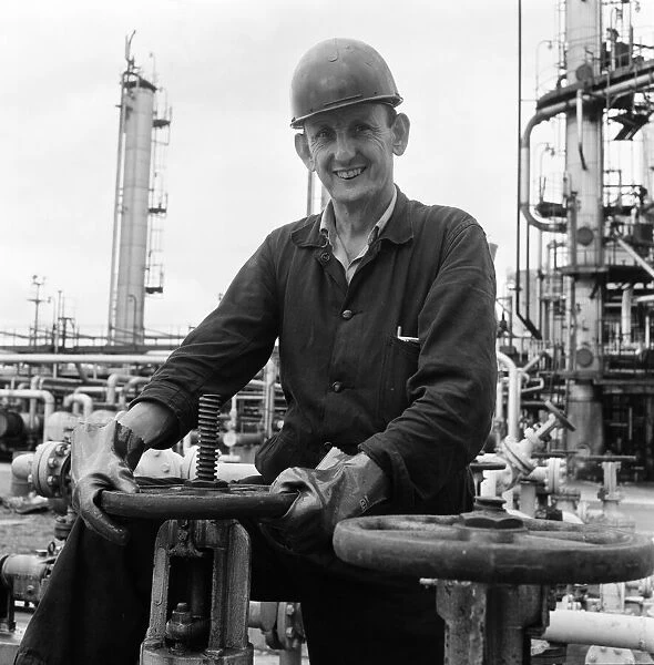 Llandarcy oil refinery. John Humphries turns off safety valve at the carbon plant