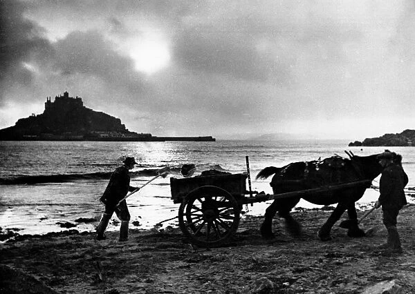 The last load before the light fails - evening beside St Michaels Mount in Cornwall