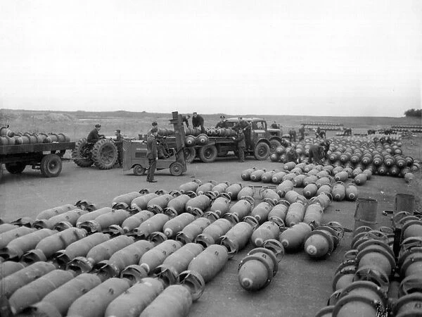 Loaded bomb trains leaving the dumps at an RAF Bomber Command Station during preparations