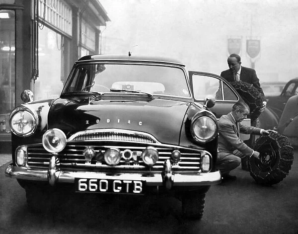 Loading the Ford Zodiac estate car, in which he will compete in the Monte Carlo rally