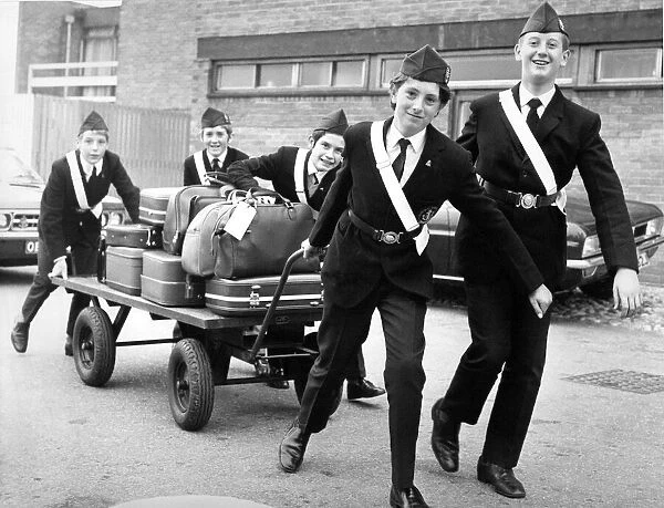 Local boys of the Boys Brigade handling luggage for visiting delegates