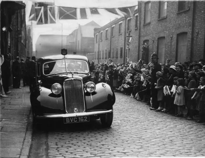 Framed Print : Local children wave their flags and cheer in Craven Street during the visit of the Duke Framed Print : Local children wave their flags and cheer in Craven Street during the visit of the Duke