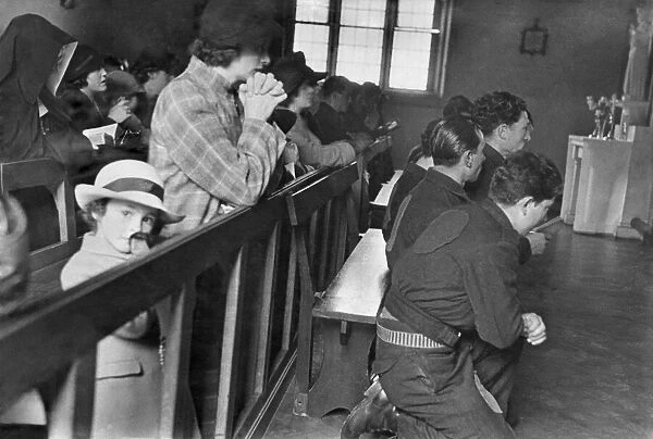 Local inhabitants in church, praying together. August 1942 P011627