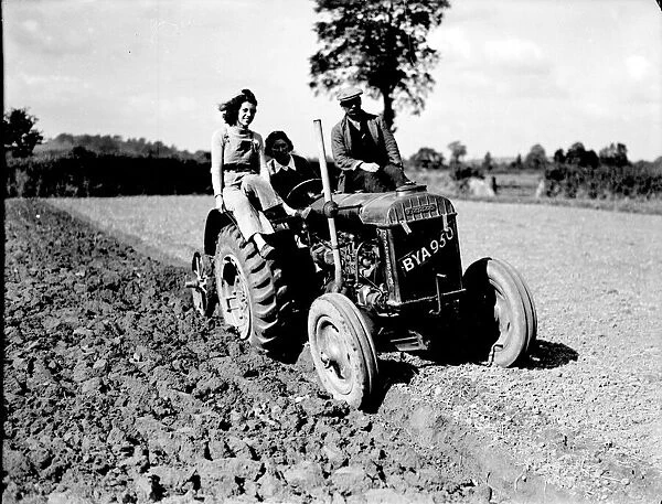 Some local Land Army girls learning to drive a Fordson tractor at the start of the last
