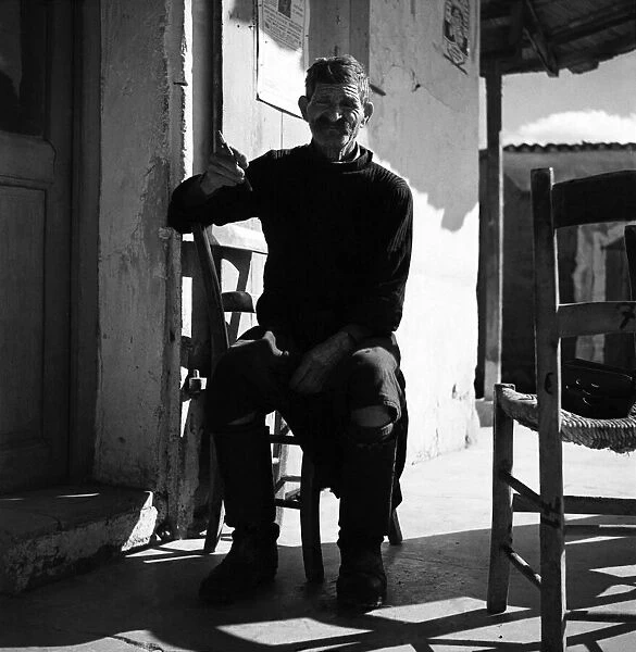 Local man of Cyprus with cigarette. November 1952 C1103-011