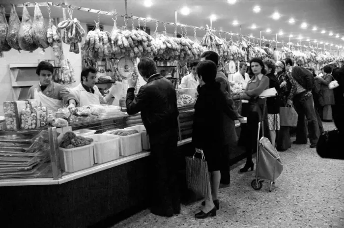 Framed Print : Local people queuing for meat at Boucherie Bernard'the largest butcher