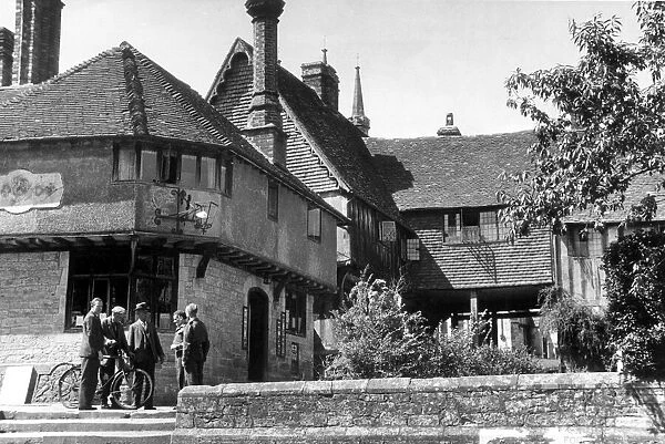 Locals gathered outside the post office in Leicester Square in the village of Penshurst