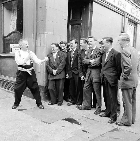The locals at 'The Clyde'pub in Govan joke with the Landlord. September 1956
