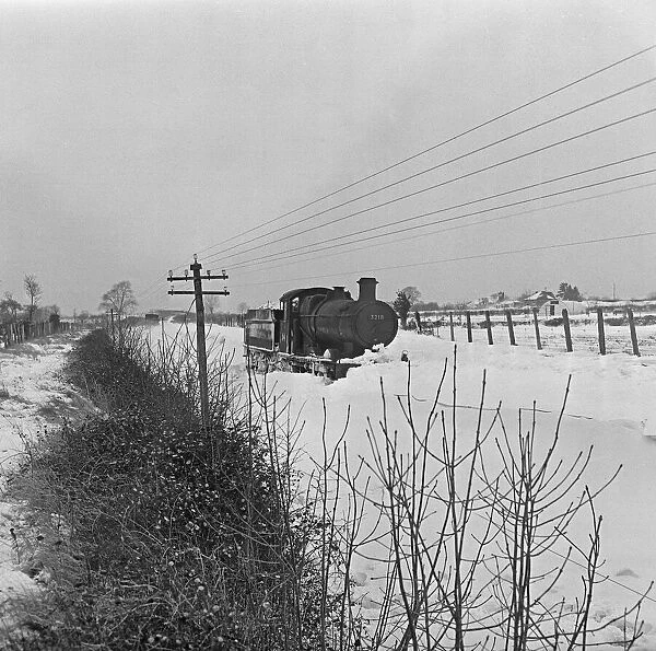 Locomotive 3218 seen here caught in a snow drift on the Somerset Levels. 1st January 1963