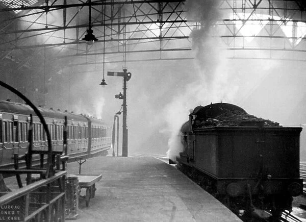 Locomotive building up a head of steam prior to leaving Liverpool Street Station c