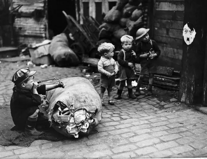 Framed Print : London children using Hitler as a target in a game of soldiers Framed Print : London children using Hitler as a target in a game of soldiers
