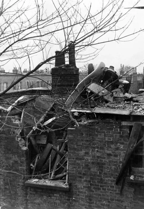 Framed Print : A London Fire Service auxiliary van thrown on to a roof by a falling bomb during