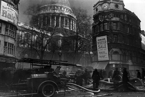 London fire service at work assembling canvas water tank in St Pauls Churchyard