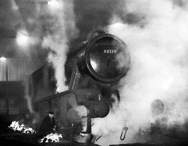 A London Midland & Scottish Railway Class 8F- Stanier locomotive engine being de-iced by