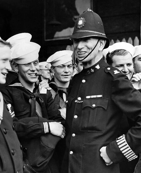 London policeman enjoying a joke with some US sailors