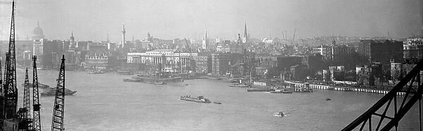The London Skyline taken from Tower Bridge showing the Pool of London, Wren Churches