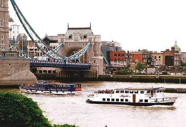 London Tourists on River Buses pass under Tower Bridge