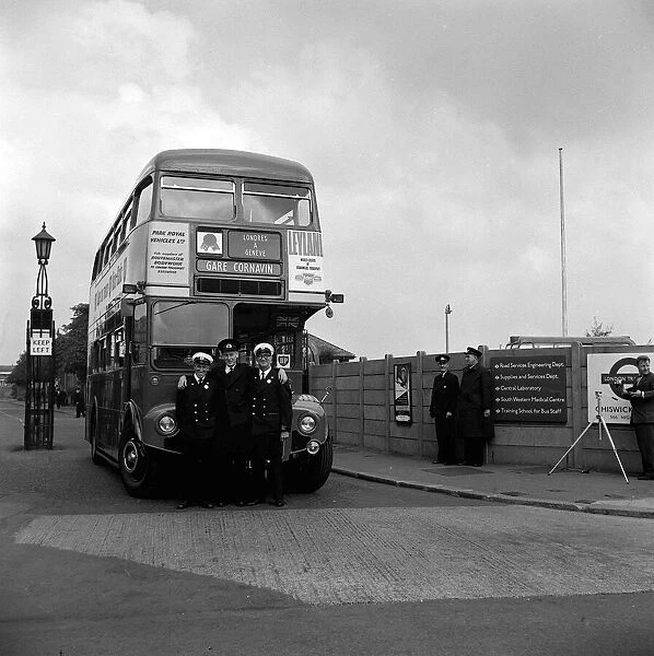 London Transport Double Decker bus and crew seen here at the Chiswick bus garage