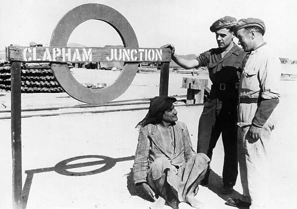 Two Londoners, Private F. Hicks and Private H. Jacobs, chat with an Iraqi labourer at