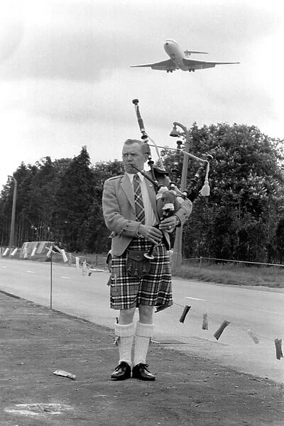 Lone bagpipe player Jim Thomas. May 1975