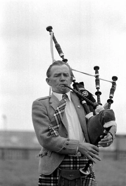Lone bagpipe player Jim Thomas. May 1975