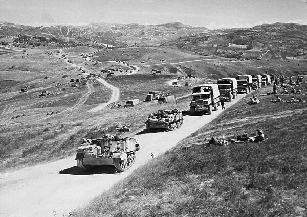 Long columns of vehicles wind over the hills of the Gothic Line