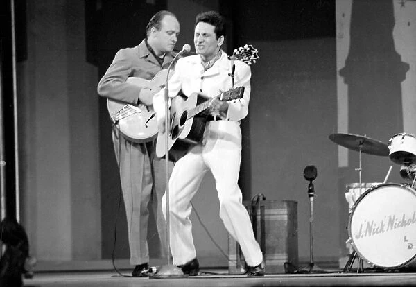 Lonnie Donegan on stage performing. h9583-124. c. October 1966