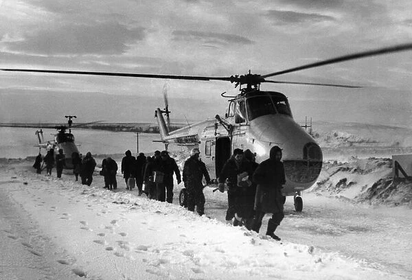 Looking like an Antartic expedition, workers at RAF Fylindales on the North Yorkshire