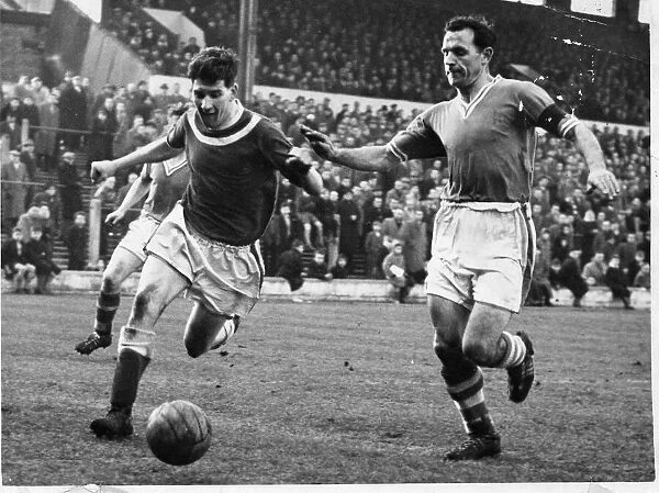 ) looks to make a tackle against on a Doncaster Rovers forward - 8th February 1958