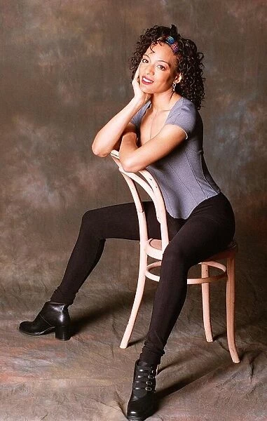Loraine Valez Actress Sitting Astride A Pink Chair