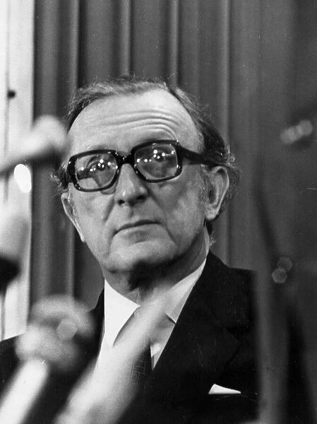 Lord Carrington at press conference behind microphones - February 1974
