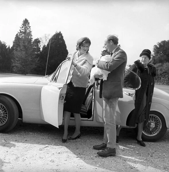 Lord Montagu and his wife, pictured on arrival at the Beaulieu, with the baby Ralph