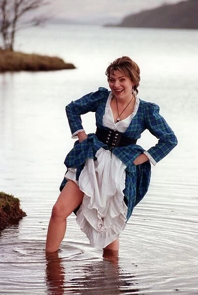 Lorraine Kelly GMTV presenter February 1998 dressed in tartan dress wading in Loch