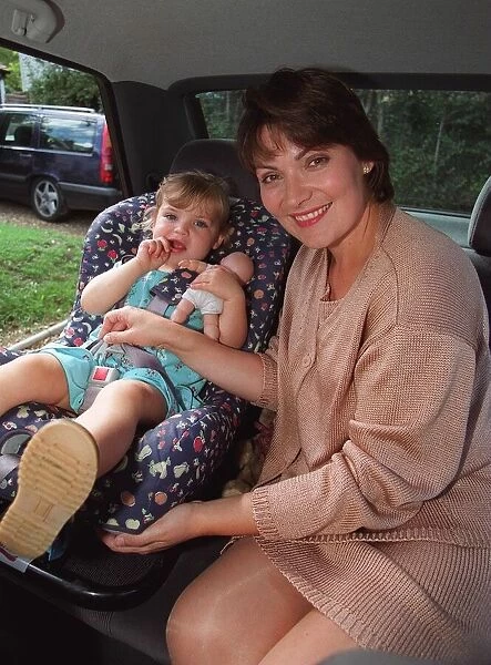 Lorraine Kelly the television presenter with her daughter with a child safety seat