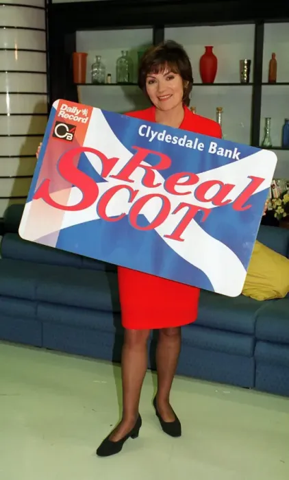 Framed Print : Lorraine Kelly TV Presenter with the Clydesdale Bank Real Scot Card wearing red suit Framed Print : Lorraine Kelly TV Presenter with the Clydesdale Bank Real Scot Card wearing red suit