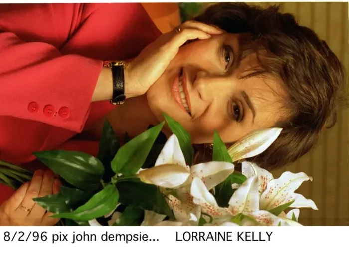 Framed Print : Lorraine Kelly TV presenter sitting next to green white plant Framed Print : Lorraine Kelly TV presenter sitting next to green white plant