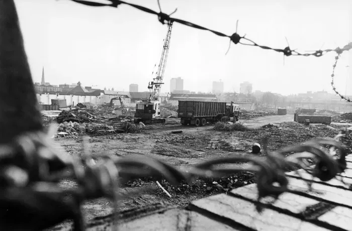 Framed Print : Lorries wait to take away the rubble which is all that remains of the former eight storey Framed Print : Lorries wait to take away the rubble which is all that remains of the former eight storey