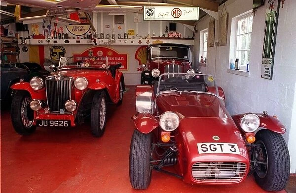 Lotus and MGTA cars in garage March 1999