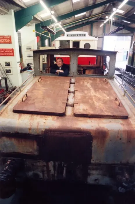 Framed Print : Lou Avis of Siemens Electronics takes a look at the 1909 Siemens engine being restored