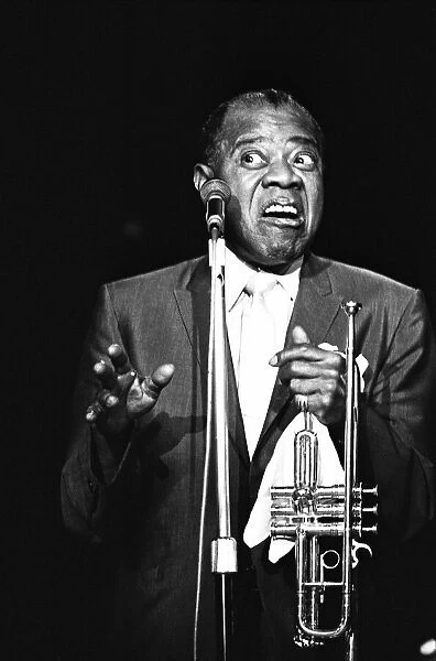 Louis Armstrong performing on stage whilst on tour circa 1968