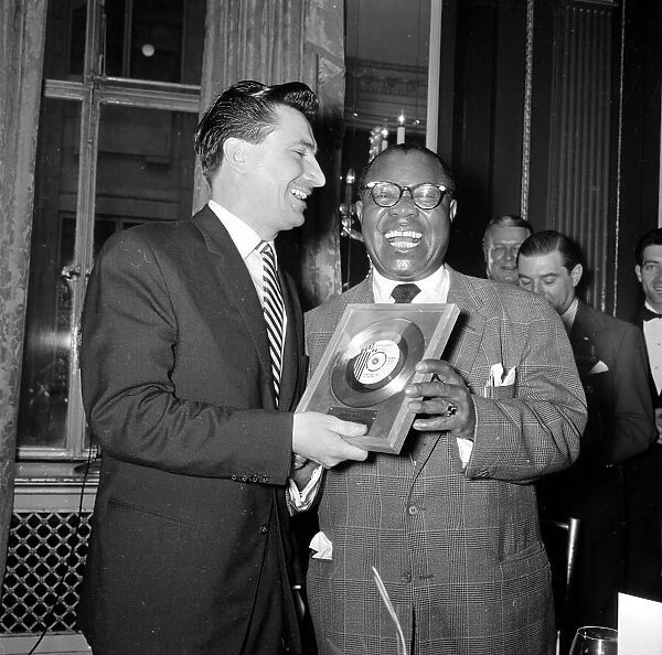 Louis Armstrong presenting Kenny Ball with a golden disc for his single Midnight in