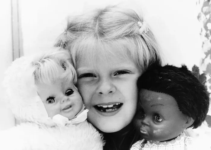 Framed Print : Louise Brown Test Tube Girl holding dolls July 1984 Framed Print : Louise Brown Test Tube Girl holding dolls July 1984