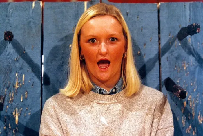 Framed Print : Louise Jones, 22, who won the auditions for the job as a knife throwers assistant with