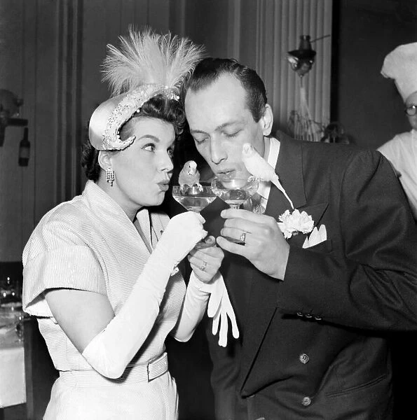 Love birds at the wedding of Mary Naylor and Jackie Koclell. March 1953 D1208