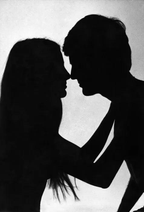 Framed Print : Love and Romance silhouette of a couple about to embrace - kiss Feburary 1979 Framed Print : Love and Romance silhouette of a couple about to embrace - kiss Feburary 1979