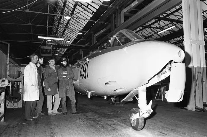 Framed Print : A lovingly restored Seahawk Hawker jet fighter is checked over by workers at the city