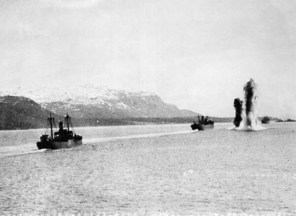 A low altitude photograph of four H. E. 115 seaplanes moored off Bergen