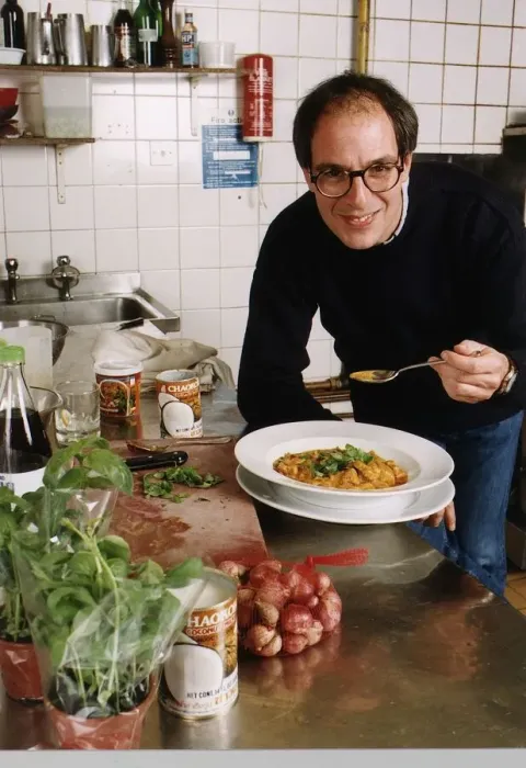 Framed Print : Loyd Grossman TV Presenter of Master Chef in his wn kitchen trying out his own cooking